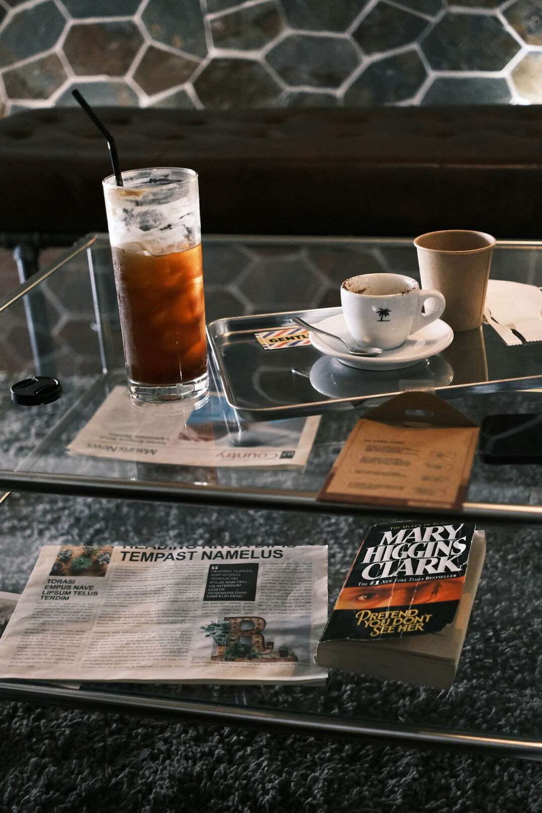 Newspaper lying on a table next to coffee
